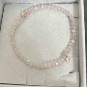 Beautiful Rose Quartz stretch bracelet 14k and diamond bezel.